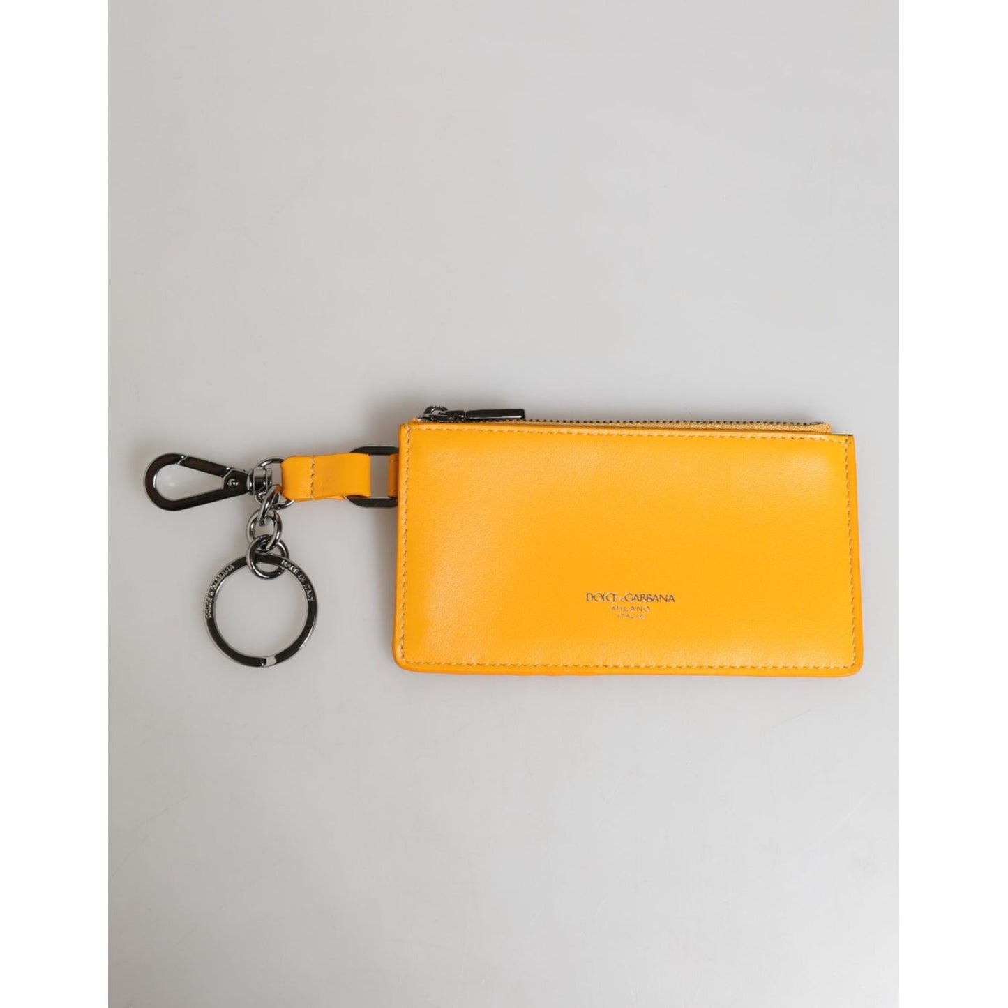 Dolce & Gabbana Yellow Orange Leather Credit Card Key Holder Clip On Wallet made from calf leather with zipper closure and logo details.