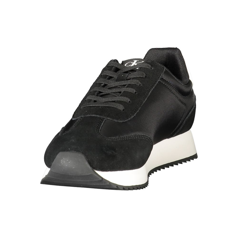 Calvin Klein Black Leather Men Sneaker with white accents and iconic logo, showcasing sleek style and refined athleticism.