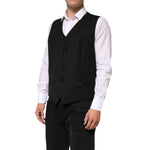 Model wearing Dolce & Gabbana Black Wool Dress Formal Men Waistcoat Vest, showcasing a classic tailored silhouette for formal occasions.