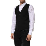 Man wearing Dolce & Gabbana Black Wool Dress Formal Men Waistcoat Vest with white shirt, showcasing sleek tailored fit.