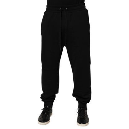 Dolce & Gabbana Black Cotton Drawstring Logo Sweatpants Pants with ribbed hems and logo patch, luxury casual streetwear style.