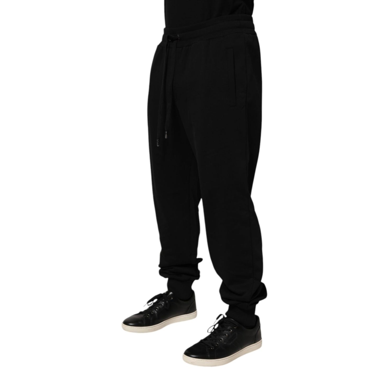 Dolce & Gabbana Black Cotton Drawstring Logo Sweatpants Pants featuring sleek design and logo patch, ideal for luxury casualwear.