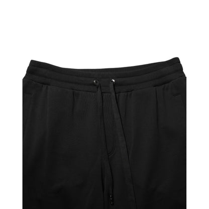 Dolce & Gabbana Black Cotton Drawstring Logo Sweatpants Pants with ribbed hems and adjustable waistband, perfect for luxury casualwear.