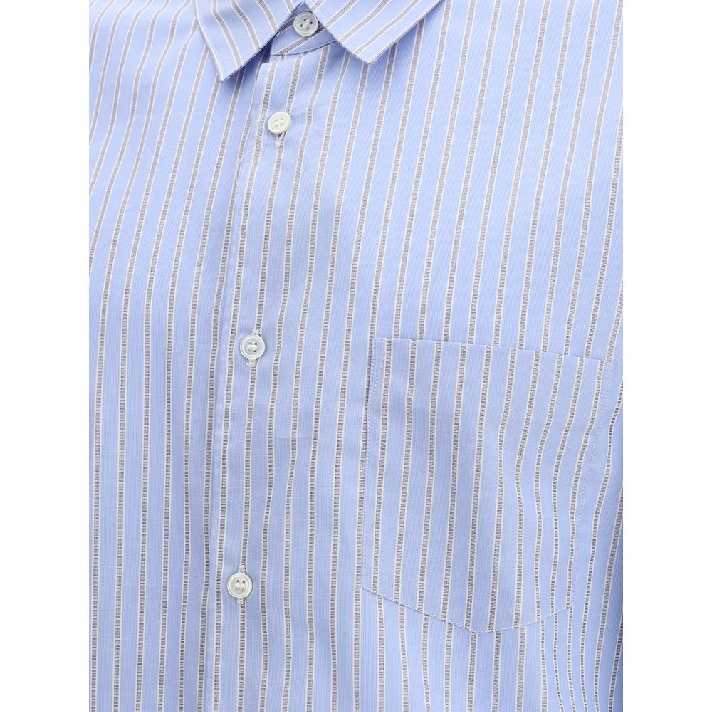 Close-up of Comme Des Garçons Light Blue Cotton Pattern Shirt with subtle stripes and button-up design.