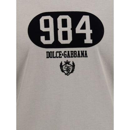 Close-up of logo on Dolce & Gabbana Brown Cotton T-Shirt featuring number 984 and crest emblem.