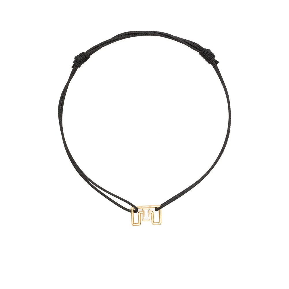 ALIITA BRACCIALI MOD. CBPUHE00KZYG09K black cord bracelet with gold detail on white background.