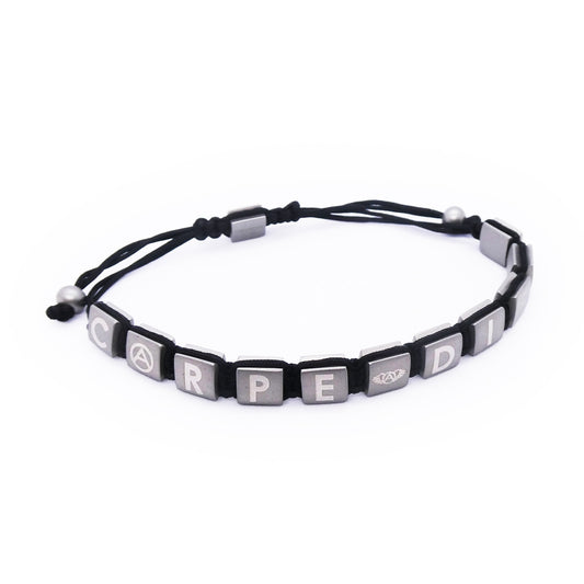 Black and silver bracelet displaying 'CARPE DIEM' with adjustable cord, designed by AN JEWELS JEWELRY Mod. AA.P222.