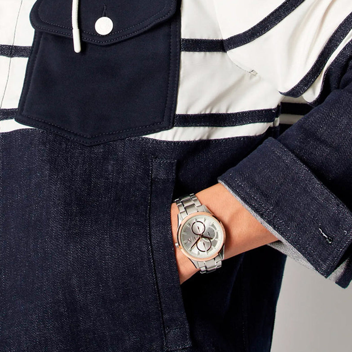 Gent wearing ARMANI EXCHANGE Mod. AX1870 wristwatch, 42mm SS IP Rose Gold case, Quartz movement, with SS bracelet, water resistant.