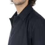 Aquascutum Blue Cotton Jacket on model, featuring button fastening and checked undercollar, side view, men's raincoat 182 cm, size 48.