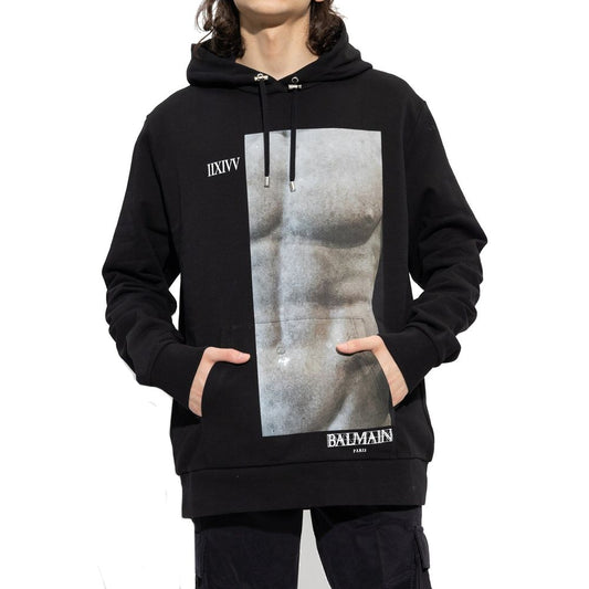 Balmain Cotton Hoodie Sweatshirt with front logo detail, drawstring hood, kangaroo pocket, long sleeves, ribbed trims, made in Italy.