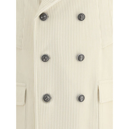 Close-up of Brunello Cucinelli Cream Cashmere Coat with ribbed texture and metal button details.