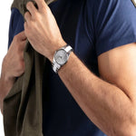 Gent wearing CALVIN KLEIN Mod. CONTRAST wristwatch, stainless steel 40mm case, 3 ATM water resistance, quartz movement.
