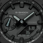 Close-up of CASIO G-SHOCK Mod. OAK - ALL BLACK watch face with multifunction dials and quartz movement, emphasizes water resistance and durability.