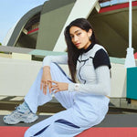Model wearing CASIO G-SHOCK Mod. OAK COMPACT - TONE ON TONE SERIE WHITE, showcasing modern fashion with water-resistant watch in urban setting.