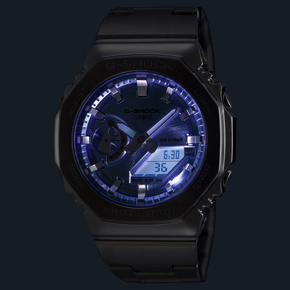 CASIO MOD. GM-2110D-2AER watch with digital and analog display, LED light, and black metal design.