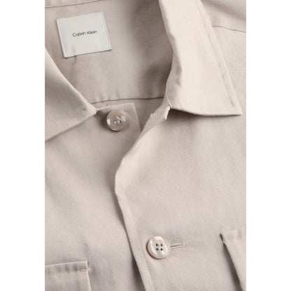 Close-up of Calvin Klein Beige Lyocell Jackets And Coat featuring button and collar details.