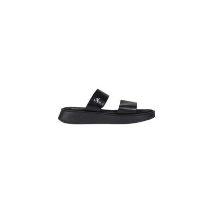 Calvin Klein Jeans Black Leather Flat Sandals with minimalist design and durable sole for summer elegance.