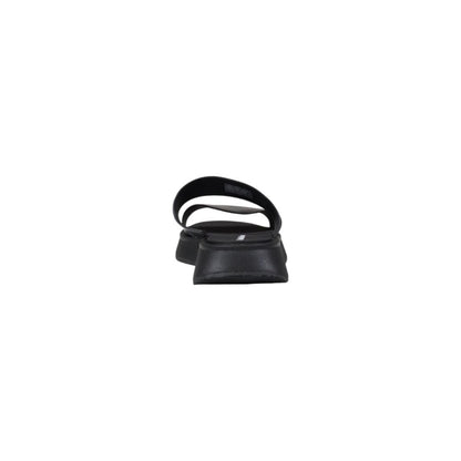 Calvin Klein Jeans Black Leather Flat Sandals rear view showcasing minimalist design and durable sole for comfort and style.