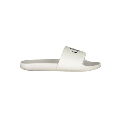 Calvin Klein White Polyester Women Sandal featuring logo-print design, ideal for poolside and casual city strolls.