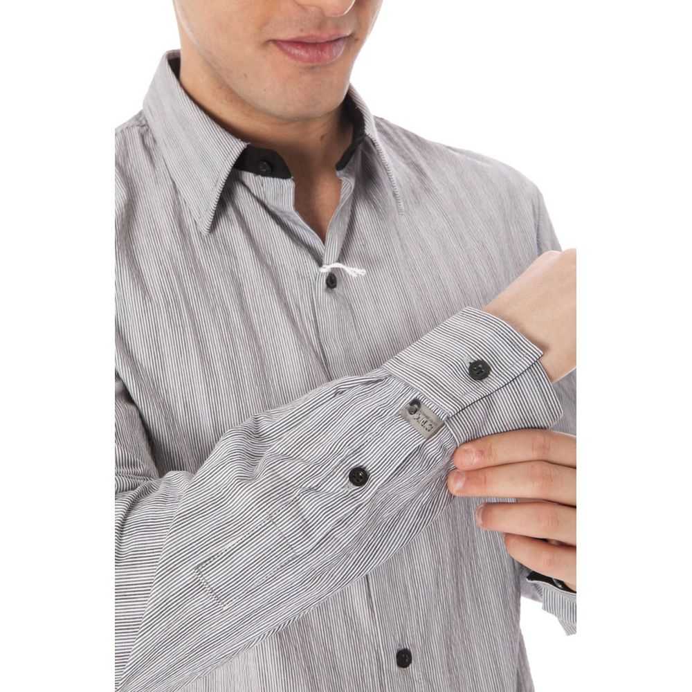 Model wearing Costume National White Cotton Men Shirt with Italian collar and buttoned cuffs.