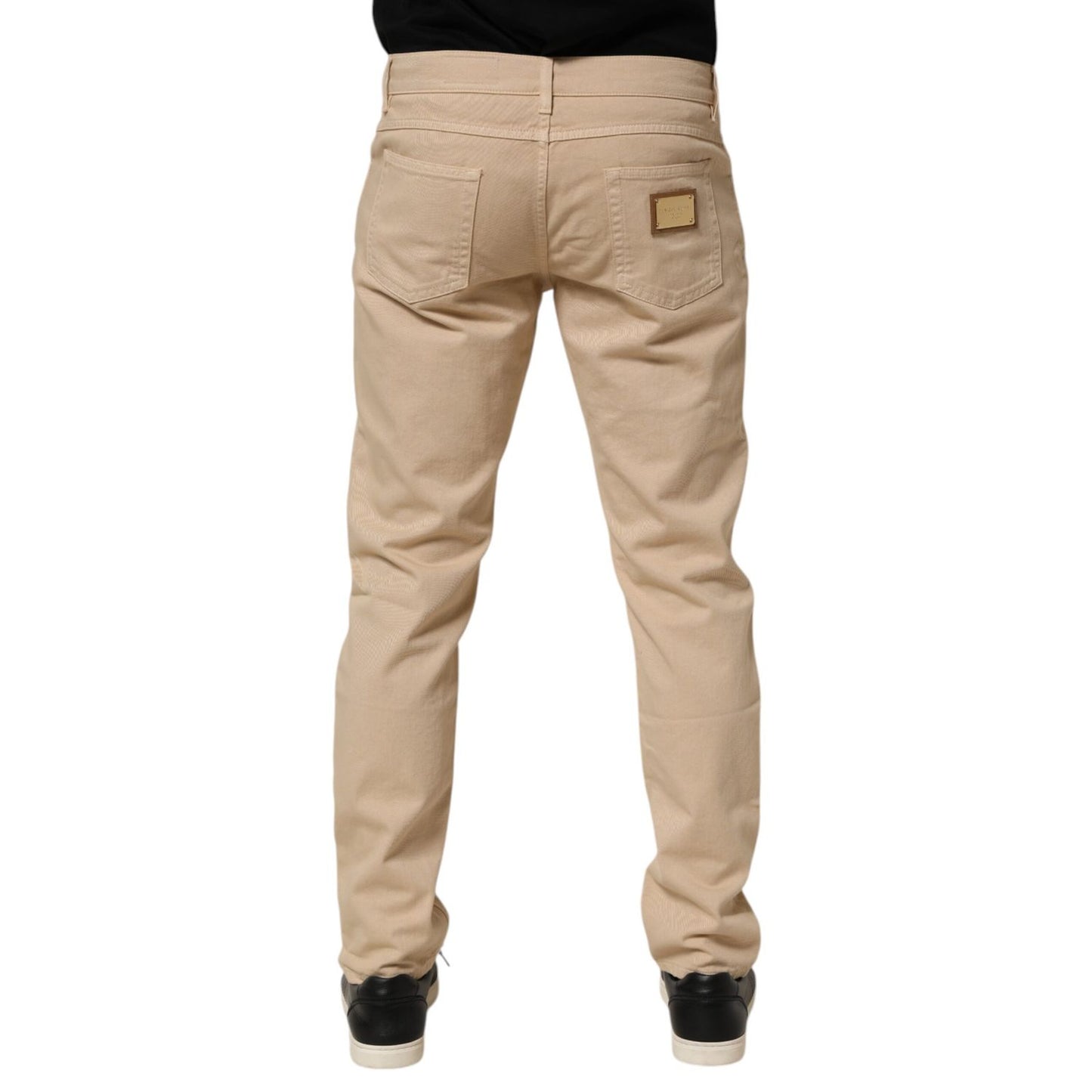 Back view of Dolce & Gabbana Beige Cotton Skinny Regular Men Denim Jeans with classic five-pocket design.