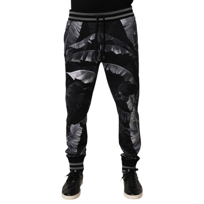 Dolce & Gabbana Black Banana Leaf Cotton Jogger Trouser Pants with elastic waistband and ribbed cuffs.