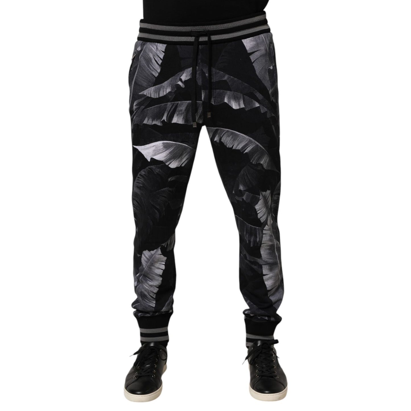 Dolce & Gabbana Black Banana Leaf Cotton Jogger Trouser Pants with elastic waistband and ribbed cuffs.