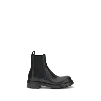 Dolce & Gabbana Black Calf Leather Bos Taurus Chelsea Boots with clean lines and Bernini base, showcasing elegance and versatility.