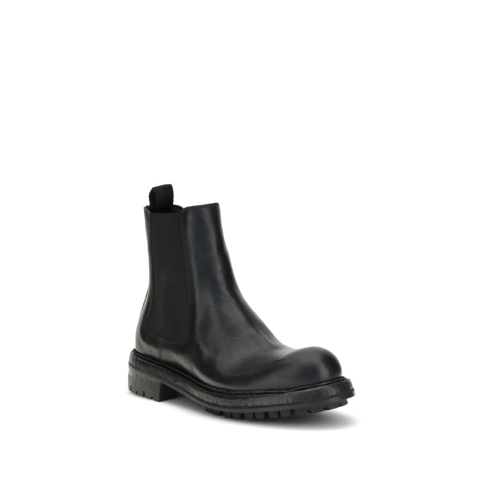 Dolce & Gabbana Black Calf Leather Bos Taurus Chelsea Boots with a sleek and elegant design.