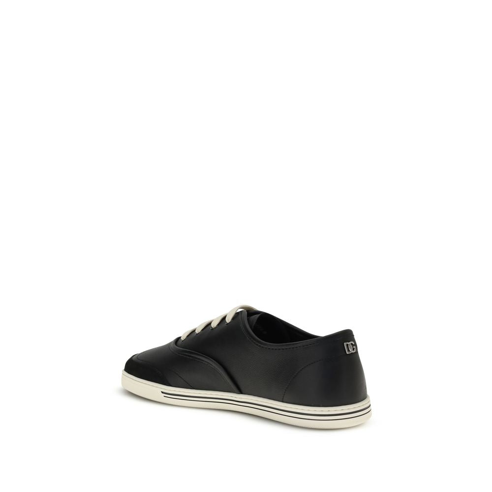 Dolce & Gabbana Black Calf Leather Bos Taurus Low Top Sneakers with TPU sole, featuring minimalist design, rear angle view.