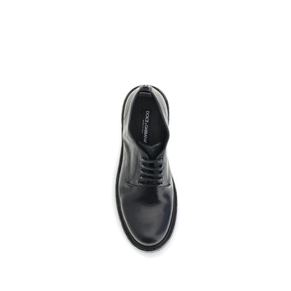 Top view of Dolce & Gabbana Black Calf Leather Bos Taurus Oxfords And Derbies with lace-up design and custom label detail.