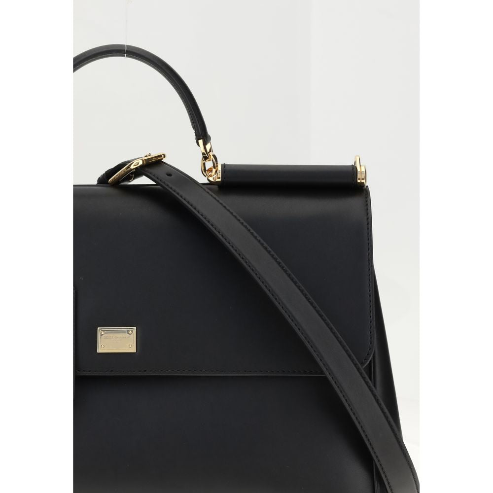 Dolce & Gabbana Black Calf Leather Bos Taurus Shoulder Bag with leather strap and vintage brass details.