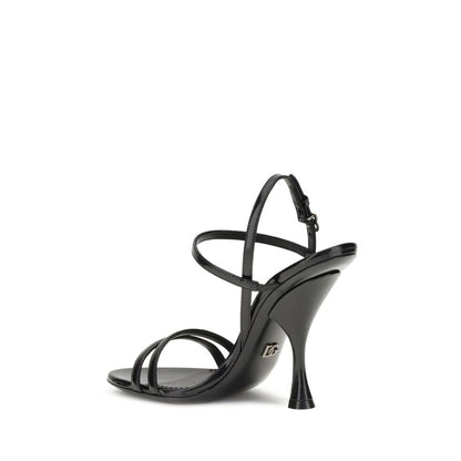 Dolce & Gabbana Black Calf Leather Bos Taurus Stiletto Heel Sandals with elegant DG palladium-plated heel detail, side view