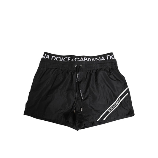 Dolce & Gabbana Black Drawstring Beachwear Men Shorts Swimwear with elastic waistband and logo details.
