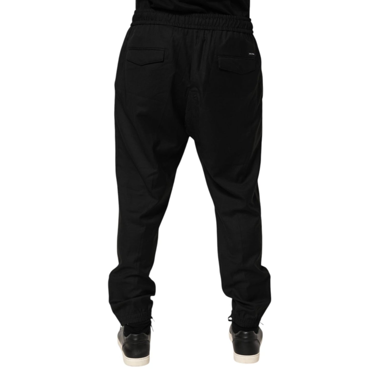 Rear view of Dolce & Gabbana Black Drawstring Men Jogger Sweatpants Pants with ribbed cuffs and adjustable waistband, perfect for streetwear.