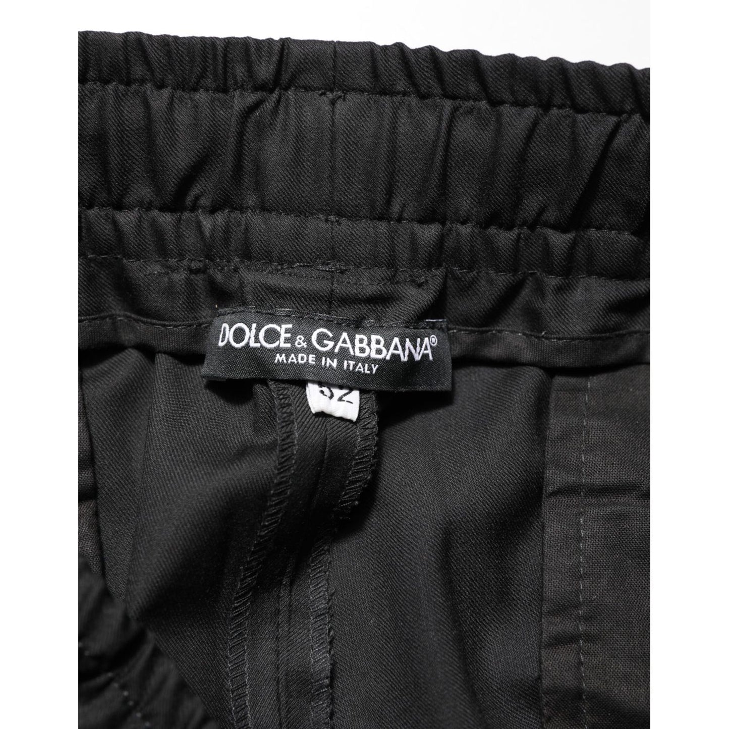 Dolce & Gabbana Black Drawstring Men Jogger Sweatpants Pants close-up label view, displaying the brand tag on black fabric.