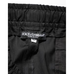 Dolce & Gabbana Black Drawstring Men Jogger Sweatpants Pants close-up label view, displaying the brand tag on black fabric.