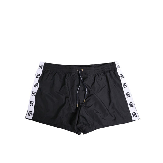 Dolce & Gabbana Black Nylon Side Logo Tape Shorts Swimwear with drawstring and logo details, featuring pockets for comfort and style.