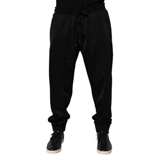 Dolce & Gabbana Black Polyester Logo Plaque Sweatpants Jogger Pants with elastic waistband and drawstring closure displayed on model.