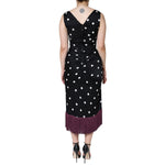 Back view of a Dolce & Gabbana Black Silk Polka Dot Vneck Tassel Midi Dress, showcasing elegant polka dots and high craftsmanship.
