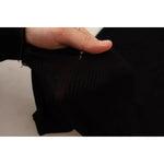 Close-up of Dolce & Gabbana Black Turtleneck Form Fitting Pullover Sweater fabric showing ribbed texture and minor defect.