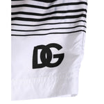 Dolce & Gabbana Black White Striped DG Logo Men Short Swimwear with bold DG logo detail on black and white striped design.