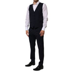 Model wearing Dolce & Gabbana Black Wool 3 Piece Slim Fit Formal Men Suit with vest, white shirt, and black trousers.