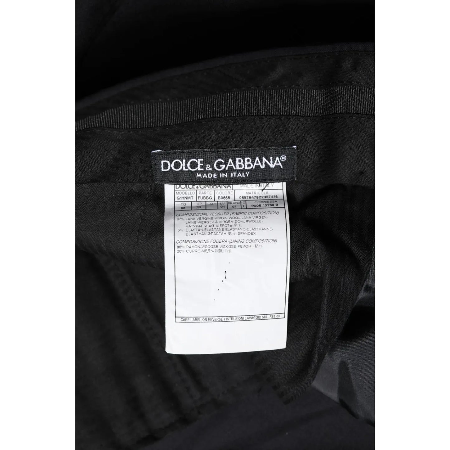 Dolce & Gabbana Black Wool Formal Dress Men Trousers Pants label with logo and Made in Italy text on black fabric.