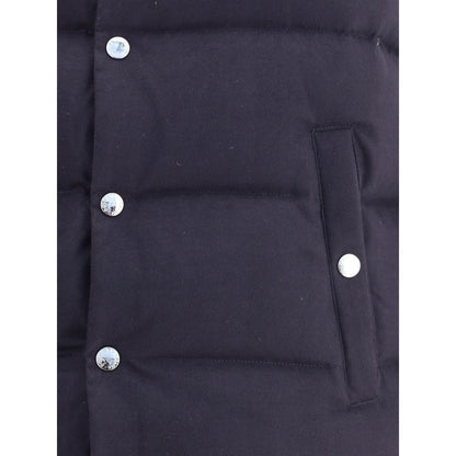 Close-up of Dolce & Gabbana Blue Cotton Jackets And Coat showing snap button closure and buttoned welt pocket with padded design.