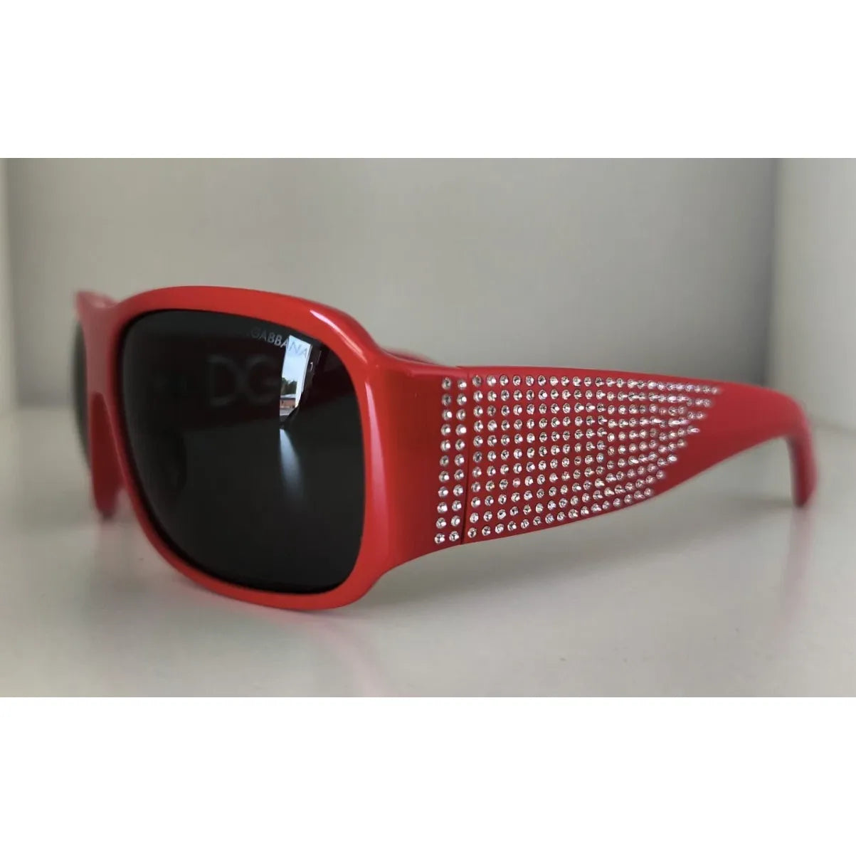 Dolce & Gabbana DG4027 Red Crystal Black Lens Shades Sunglasses for women with 100% UV protection, polycarbonate material, made in Italy.