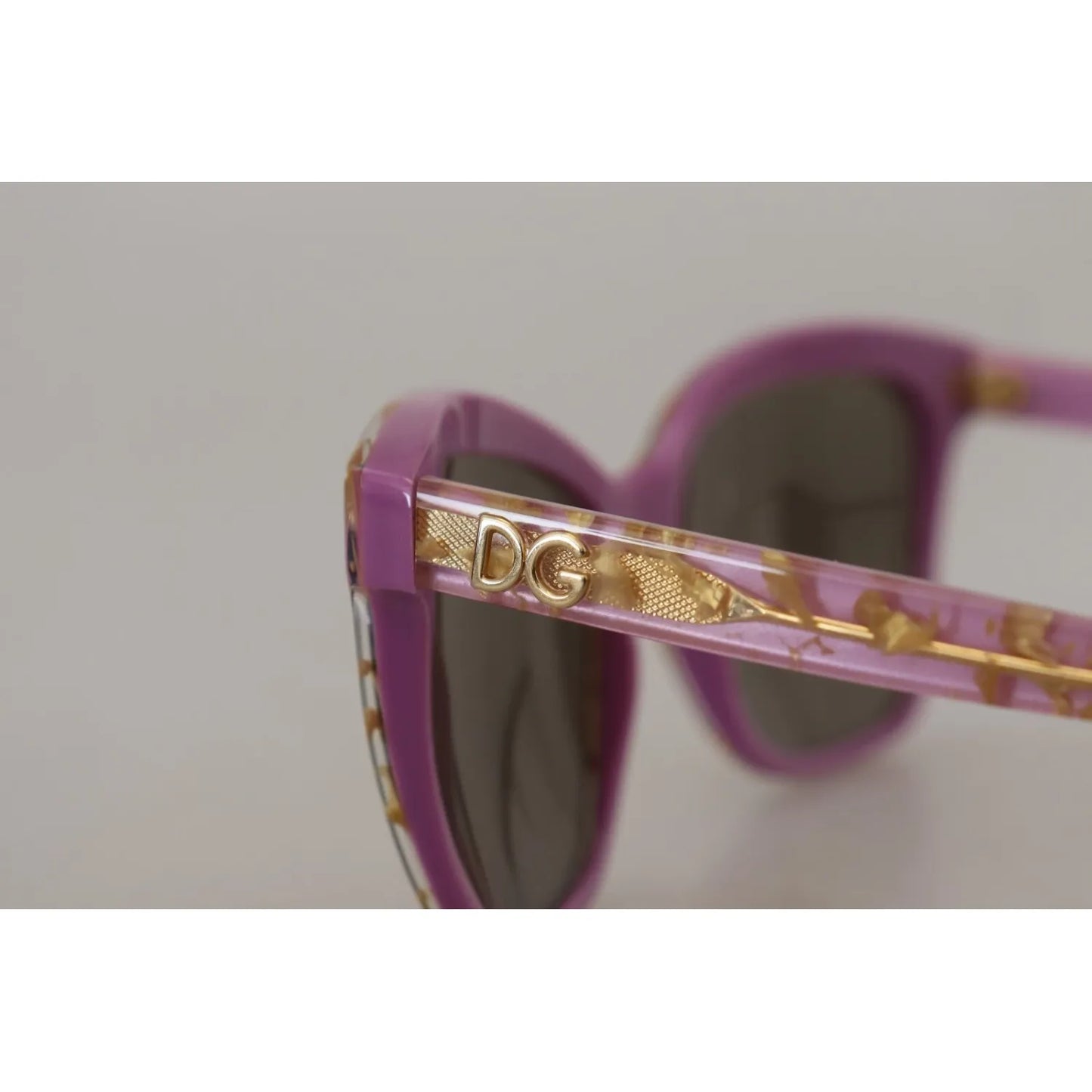 Detailed view of Dolce & Gabbana DG4251 Violet Full Rim Rectangle Frame Shades Sunglasses with gold 'DG' logo on vibrant violet temples.