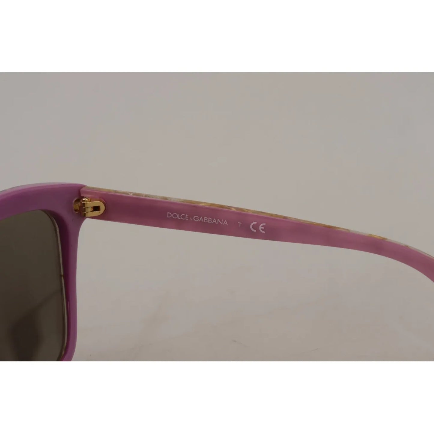 Close-up of Dolce & Gabbana DG4251 Violet Full Rim Rectangle Frame Shades Sunglasses with brown lenses and minor lens scratches.