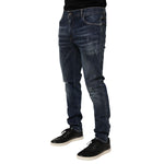 Dolce & Gabbana Dark Blue Washed Running Ripped Denim Jeans displayed on model with black shoes