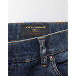 Dolce & Gabbana Dark Blue Washed Running Ripped Denim Jeans label close-up with classic five-pocket styling for modern streetwear.